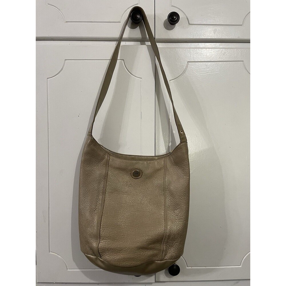 The SAK Gold Pebbled Leather Hobo Shoulder Bag Purse Single Strap Handbag